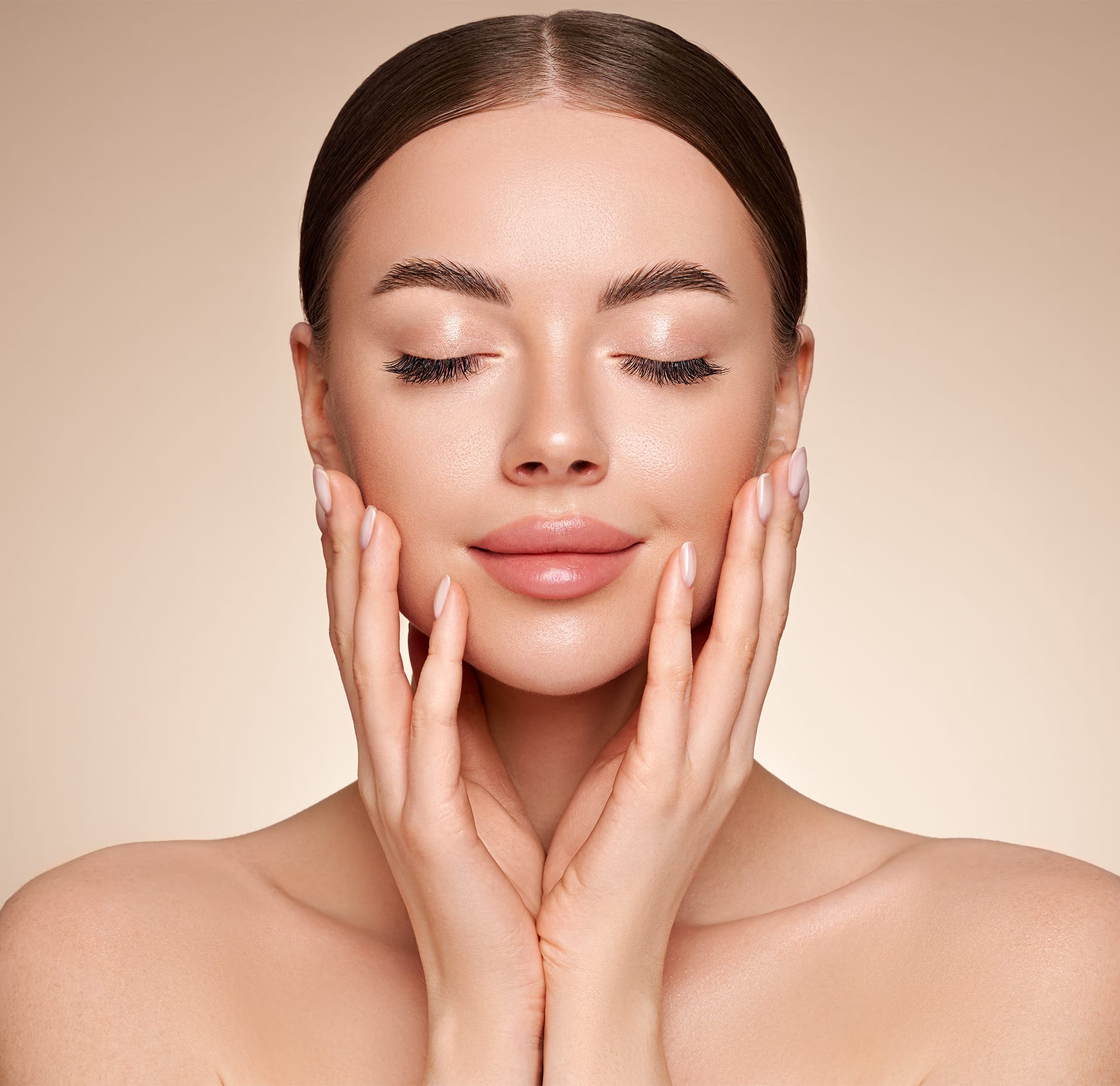 Woman posing with her hands on her cheeks